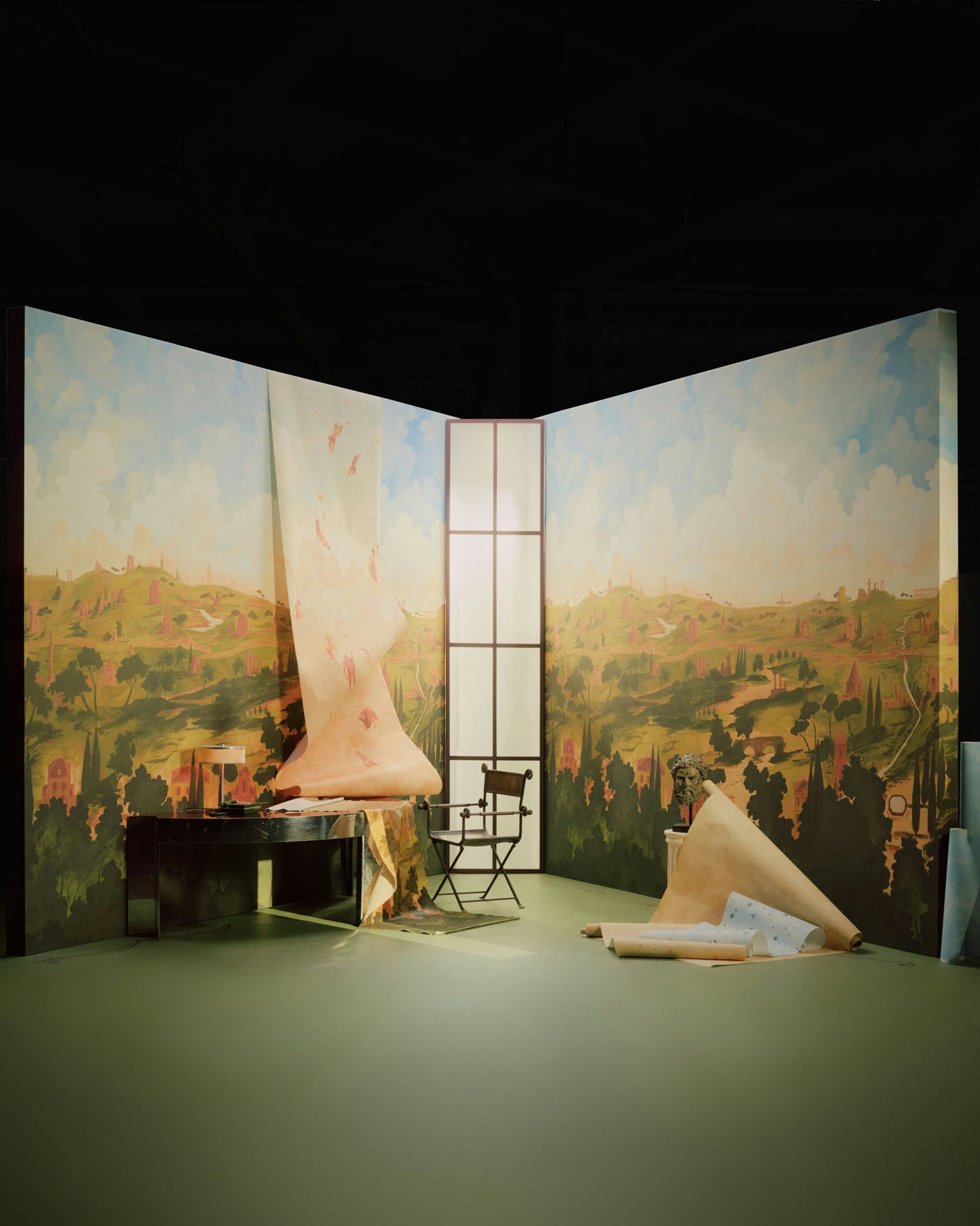 inspired by the legendary road to rome, appian way panel set is a transportive hand-painted scenic panorama by artist xavier donnelly. a landscape of ruins, monuments, and villas painted in rich detail creates a sense of mystery and surprise throughout the design. at 15’ tall by 16’ wide, the scenic mural moves from dense forest to layered architecture to billowing clouds, trimmable for any room. the dramatic scale and stunning painted texture capture the feeling of a fresco painted directly on the wall.  by Backdrop. – Office, Wallcoverings