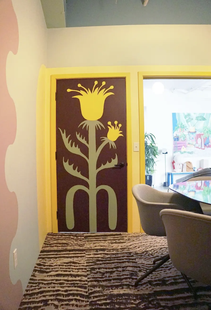 PABLO HONEY, DRIVE-THRU SAFARI, LOBBY SCENE, warm, bright yellow, soft green, dark, warm purple-red paint colors by Backdrop. – Bold, Yellow, Bold, Green, Dark, Purple, Red, Office, Accents, Door, Trim, Shapes, Art/Mural