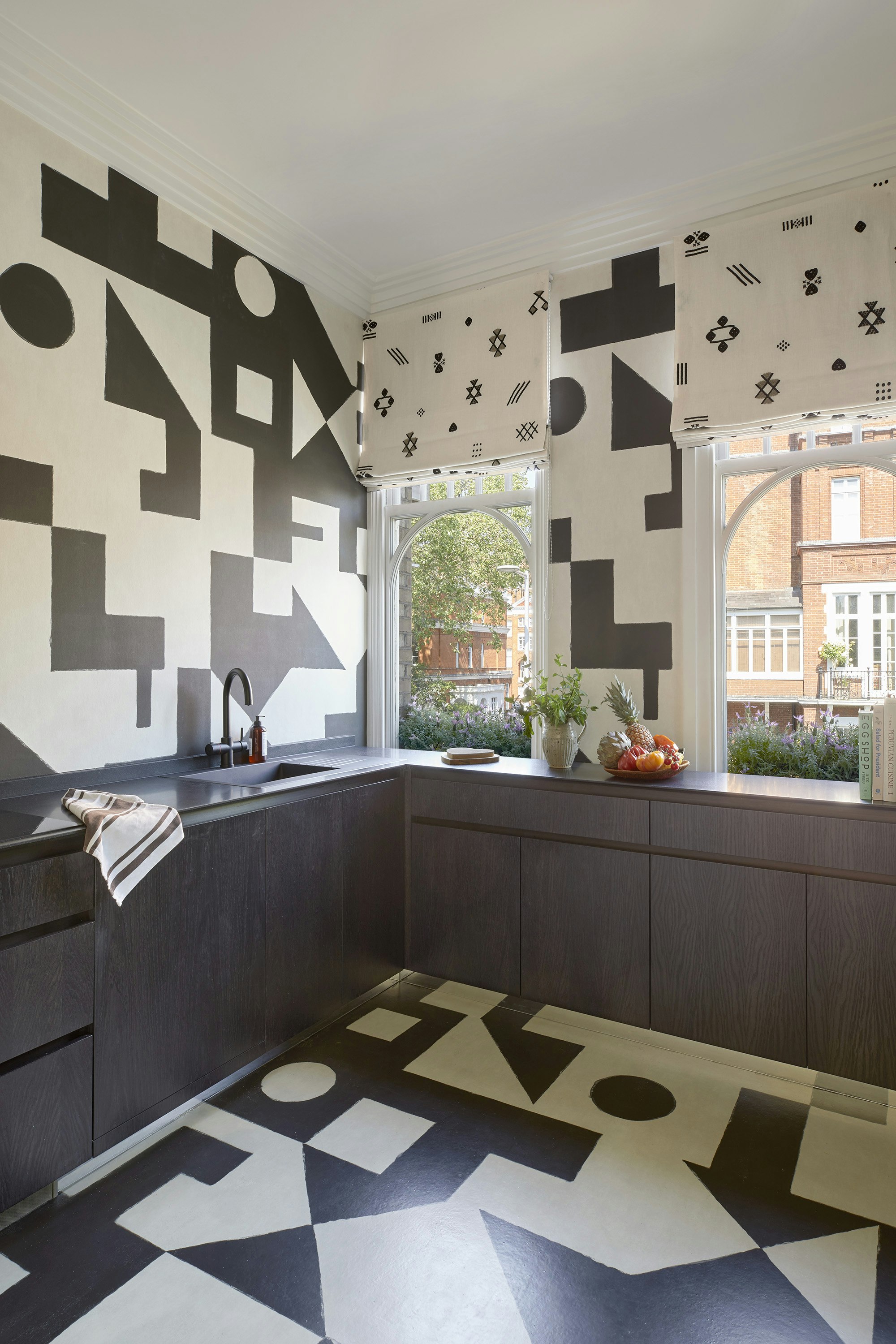 elevate your space with the captivating allure of porter teleo's graphic geometric pattern. this stylish design, with a two-panel repeat, creates a mural-like effect that is perfect for enhancing large expanses in your home decor. immerse your surroundings in the modern aesthetic of bold shapes, making a striking statement on your walls.  by Backdrop. – Kitchen, Wallcoverings