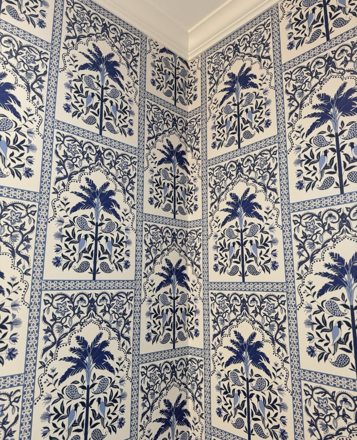 fashion designer johanna ortiz was inspired by indian block prints and her colombian heritage when she imagined amazonas mystique, a chic tropical wallpaper with fabulous flair. a decorative half-drop grid beautifully frames stylized palms, parakeets, and floral paisleys. this vibrant medium-scale pattern lends an enchanting island element to any room.  by Backdrop. – Add Me, Bathroom, Wallcoverings