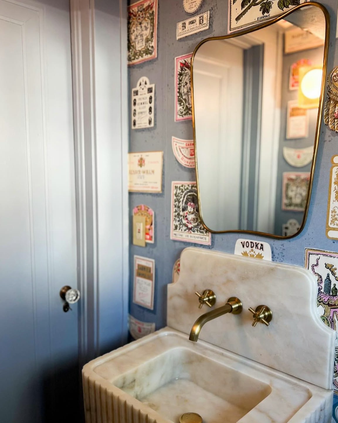 the perfect balance of charming and sophisticated, salud is a playful update on a 1950’s schumacher archival design of the same name. this storied design, featured in the 1995 cooper hewitt exhibition - kitsch to corbusier: wallpaper from the 1950's, highlights multi-colored hand-illustrated liquor labels in a graphic layout. this lively wide-width design will bring maximalist impact to any space.  by Backdrop. – Bathroom, Wallcoverings