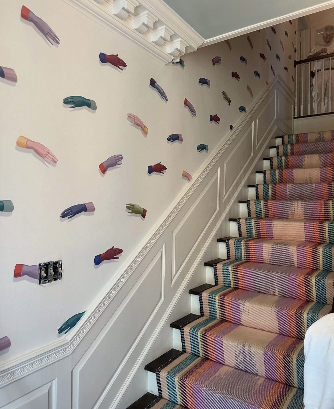 manos by charlap hyman & herrero with pilar almon is a visually striking design, inspired by hand-painted art. the wallpaper features an array of delicately rendered, disembodied hands that seem to gracefully float within the large-scale repeat, creating a mural-like effect. the design is a nod to surrealist imagery and adds an unexpected artistic touch to any interior space.  by Backdrop. – Add Me, Entryway, Hallway, Accents, Wallcoverings