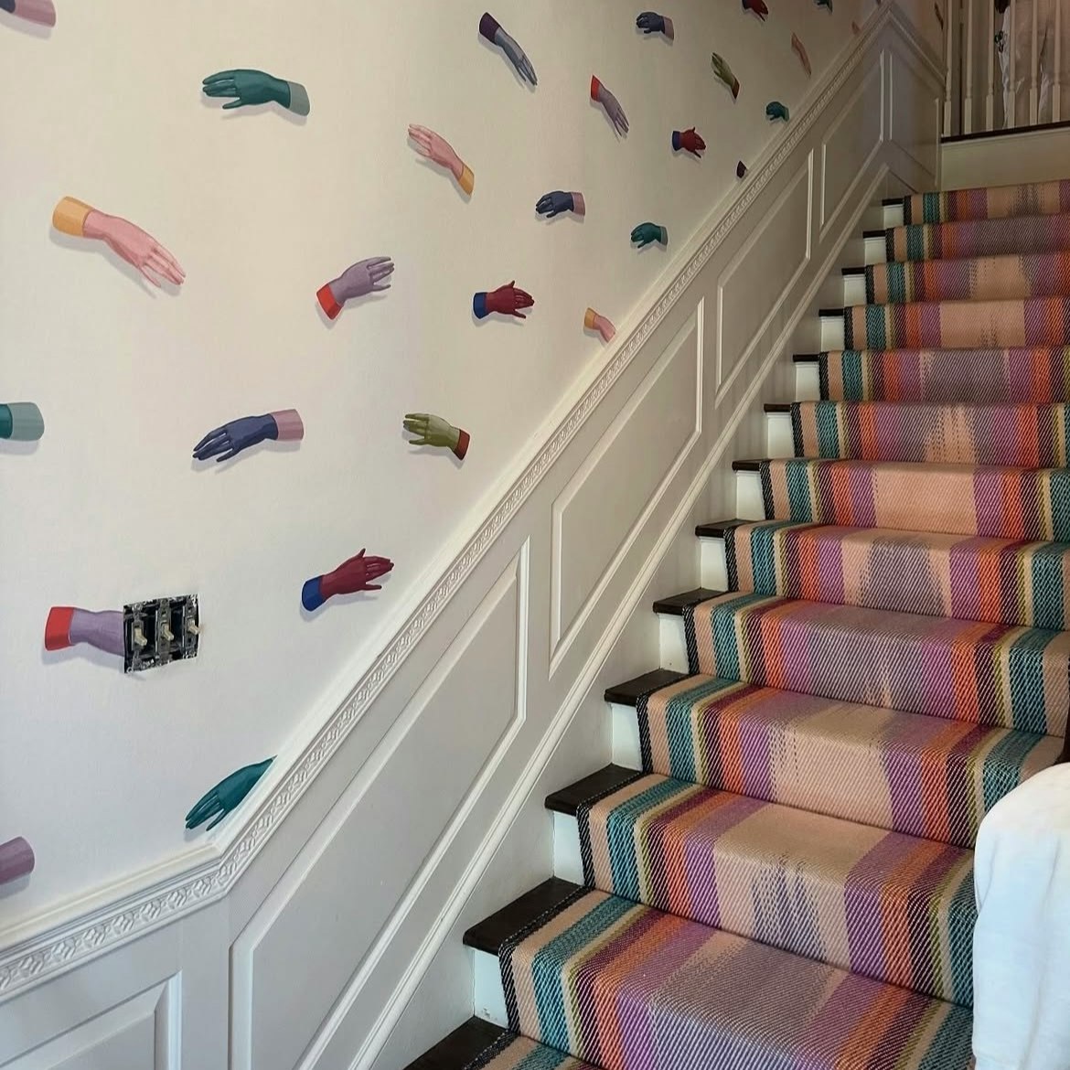 manos by charlap hyman & herrero with pilar almon is a visually striking design, inspired by hand-painted art. the wallpaper features an array of delicately rendered, disembodied hands that seem to gracefully float within the large-scale repeat, creating a mural-like effect. the design is a nod to surrealist imagery and adds an unexpected artistic touch to any interior space. by Backdrop. – Add Me, Entryway, Hallway, Accents, Wallcoverings