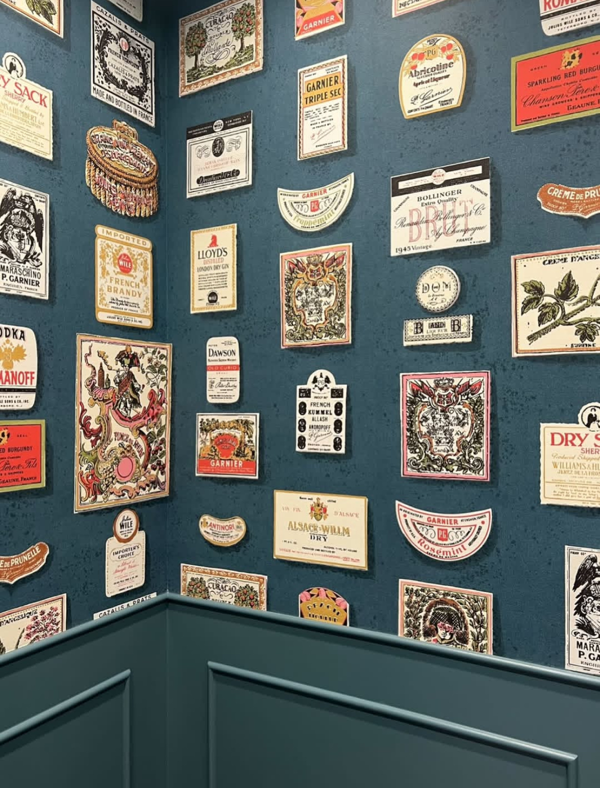 the perfect balance of charming and sophisticated, salud is a playful update on a 1950’s schumacher archival design of the same name. this storied design, featured in the 1995 cooper hewitt exhibition - kitsch to corbusier: wallpaper from the 1950's, highlights multi-colored hand-illustrated liquor labels in a graphic layout. this lively wide-width design will bring maximalist impact to any space.  by Backdrop. – Living Room, Office, Featured Review, Wallcoverings